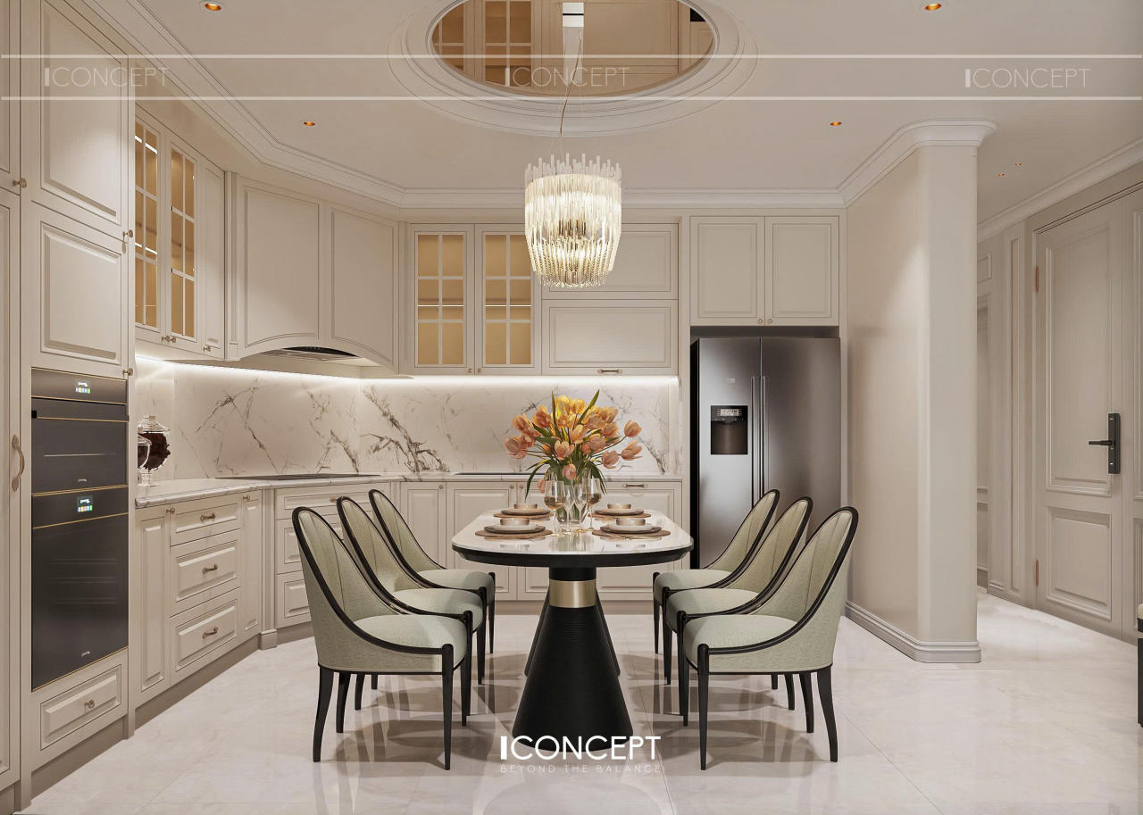 Gam màu trắng kem kết hợp đá marble vân tự nhiên và ánh sáng vàng ấm tạo nên một không gian bếp thanh lịch